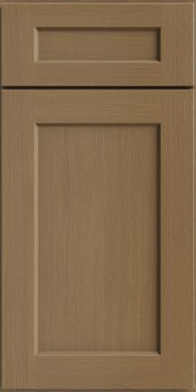 Wooden cabinet door with two inset panels in a light oak finish showing grain texture and framed edges