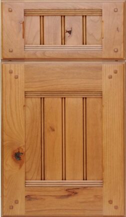 Tall wooden cabinet with a small top drawer and a larger lower door featuring beaded panel details in a warm natural finish